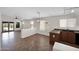 A bright kitchen/dining area featuring tile floors, ample windows, and a breakfast bar at 17418 N Carmen Ave, Maricopa, AZ 85139