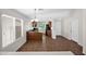 A bright kitchen/dining area featuring tile floors, ample windows, and a breakfast bar at 17418 N Carmen Ave, Maricopa, AZ 85139