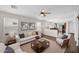 Cozy living room with neutral tones, plush seating, and lots of natural light at 17418 N Carmen Ave, Maricopa, AZ 85139