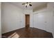This bedroom has wood floors, closet space and a ceiling fan at 1750 W Union Hills Dr # 8, Phoenix, AZ 85027