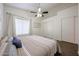 Bedroom featuring spacious closets, wood floors, ceiling fan and nature inspired art at 1750 W Union Hills Dr # 8, Phoenix, AZ 85027
