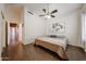 Bedroom featuring wood floors, ceiling fan and nature inspired art at 1750 W Union Hills Dr # 8, Phoenix, AZ 85027