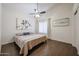 Cozy bedroom with wood flooring, ceiling fan, complemented by nature-inspired artwork at 1750 W Union Hills Dr # 8, Phoenix, AZ 85027