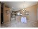 Open-concept dining area with tile floors leading to kitchen and living spaces at 1750 W Union Hills Dr # 8, Phoenix, AZ 85027