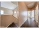 Upstairs hallway leading to bedrooms with wood flooring and access to the staircase at 1750 W Union Hills Dr # 8, Phoenix, AZ 85027