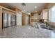 Modern kitchen featuring granite countertops, stainless steel refrigerator and neutral colored cabinetry at 1750 W Union Hills Dr # 8, Phoenix, AZ 85027