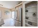 Bright kitchen area with stainless steel refrigerator and open pantry shelves at 1750 W Union Hills Dr # 8, Phoenix, AZ 85027