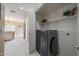 Laundry room featuring a modern washer and storage shelves at 1750 W Union Hills Dr # 8, Phoenix, AZ 85027