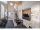 Comfortable living room featuring high ceilings, staircase, tiled floors, and ample natural light at 1750 W Union Hills Dr # 8, Phoenix, AZ 85027