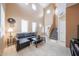 Bright living room with high ceilings, tiled floors, and a staircase at 1750 W Union Hills Dr # 8, Phoenix, AZ 85027