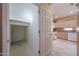 Pantry leading to the kitchen with a wire shelf and tile floor at 1750 W Union Hills Dr # 8, Phoenix, AZ 85027