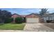 Charming single-story brick home with a well-manicured lawn and mature landscaping at 1835 E Cortez Dr, Gilbert, AZ 85234