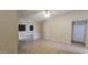 Open living room with tile flooring and neutral paint, with easy access to other spaces at 1835 E Cortez Dr, Gilbert, AZ 85234