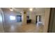 Open-concept living space with tile flooring, high ceilings, and views to the kitchen and dining areas at 1835 E Cortez Dr, Gilbert, AZ 85234