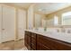 Bathroom features double sinks and a large mirror at 18417 W Elm St, Goodyear, AZ 85395