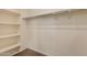 Walk-in closet with shelving and rod for hanging clothes at 18417 W Elm St, Goodyear, AZ 85395