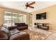 Bright living room offering a sliding glass door that lets in natural light and leads to the outdoor space at 18417 W Elm St, Goodyear, AZ 85395