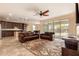 Living room features an open-concept layout, tile floors, and glass sliding doors leading to the backyard at 18417 W Elm St, Goodyear, AZ 85395