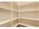 Walk-in pantry features bright, white shelving and ample storage space at 18417 W Elm St, Goodyear, AZ 85395