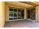 Covered patio with sliding glass doors, seamlessly connecting indoor and outdoor living spaces at 18417 W Elm St, Goodyear, AZ 85395