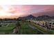 Aerial view of luxury homes bordering the golf course, and mountains in the background at 2 Biltmore Est # 309, Phoenix, AZ 85016