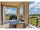 Outdoor dining area on the balcony with a golf course view, perfect for entertaining at 2 Biltmore Est # 309, Phoenix, AZ 85016