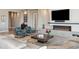Relaxing living room featuring a sleek fireplace, cozy seating, and modern décor at 2 Biltmore Est # 309, Phoenix, AZ 85016