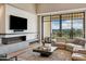 Comfortable living room with modern fireplace, stylish furnishings, and picturesque views at 2 Biltmore Est # 309, Phoenix, AZ 85016