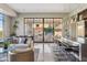 Community lounge with oversized seating and expansive windows to pool area and outdoor dining at 2 Biltmore Est # 309, Phoenix, AZ 85016