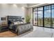 Luxurious main bedroom with a large window view, plush bedding, and stylish decor at 2 Biltmore Est # 309, Phoenix, AZ 85016