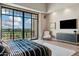 Comfortable main bedroom with balcony access, plenty of natural light, and modern accents at 2 Biltmore Est # 309, Phoenix, AZ 85016
