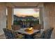 Cozy outdoor fireplace on the balcony, perfect for enjoying scenic mountain views at sunset at 2 Biltmore Est # 309, Phoenix, AZ 85016