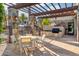 Outdoor kitchen and dining area perfect for al fresco meals and gatherings at 2 Biltmore Est # 309, Phoenix, AZ 85016