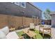 Backyard space featuring a small lawn area with comfortable seating and a privacy wall at 2024 W Trotter Trl, Phoenix, AZ 85085