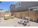 Private backyard patio with comfortable seating, fire pit, and desert landscaping at 2024 W Trotter Trl, Phoenix, AZ 85085