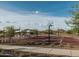 Outdoor basketball court surrounded by picnic tables and lush landscaping, offering recreational opportunities in a scenic setting at 2024 W Trotter Trl, Phoenix, AZ 85085