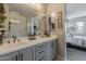 Bathroom featuring double sinks, neutral color scheme, and large mirrors at 2024 W Trotter Trl, Phoenix, AZ 85085