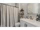 Elegant bathroom featuring modern fixtures, white vanity, and shower with curtain at 2024 W Trotter Trl, Phoenix, AZ 85085