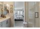 Modern bathroom design with glass-enclosed shower, access to a bedroom at 2024 W Trotter Trl, Phoenix, AZ 85085
