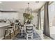 Chic dining area with modern lighting and seating, adjacent to the kitchen and living spaces, perfect for entertaining at 2024 W Trotter Trl, Phoenix, AZ 85085