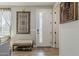 Inviting entryway with a white door, decorative rug, bench with shoe storage, and neutral wall color at 2024 W Trotter Trl, Phoenix, AZ 85085