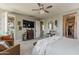 Relaxing bedroom with a large closet, TV, and comfortable furniture at 2024 W Trotter Trl, Phoenix, AZ 85085