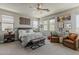 Spacious main bedroom boasts natural light, seating area, and calming decor at 2024 W Trotter Trl, Phoenix, AZ 85085