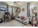 Bright office space featuring desk, chair, couch, and ample shelving at 2024 W Trotter Trl, Phoenix, AZ 85085