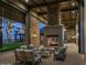 Community outdoor patio with a fireplace and comfortable seating at dusk at 2024 W Trotter Trl, Phoenix, AZ 85085