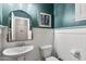 Elegant powder room with white wainscoting, a decorative mirror, and stylish fixtures at 21288 E Via Del Sol --, Queen Creek, AZ 85142