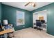 This bedroom features a ceiling fan, plush carpet, and a dedicated area for studying or work at 21288 E Via Del Sol --, Queen Creek, AZ 85142