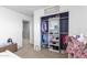 Bedroom closet with custom shelving and a variety of clothing at 21288 E Via Del Sol --, Queen Creek, AZ 85142