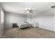 This bedroom has neutral carpet, window shutters, and calming gray wall paint at 21288 E Via Del Sol --, Queen Creek, AZ 85142