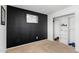This is a cozy bedroom with a modern black accent wall and a spacious closet at 21288 E Via Del Sol --, Queen Creek, AZ 85142